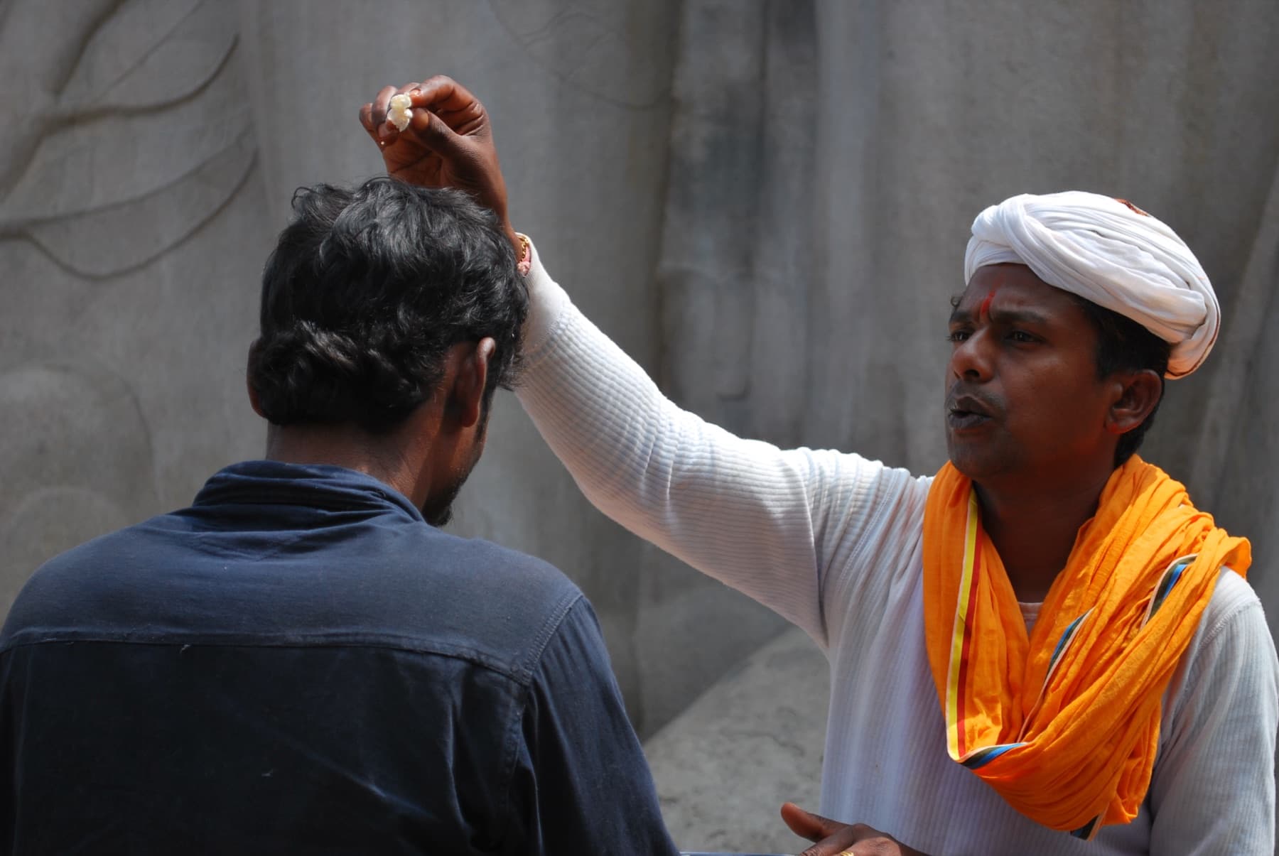 A Hindu priest giving a blessing in Belur, Karnataka