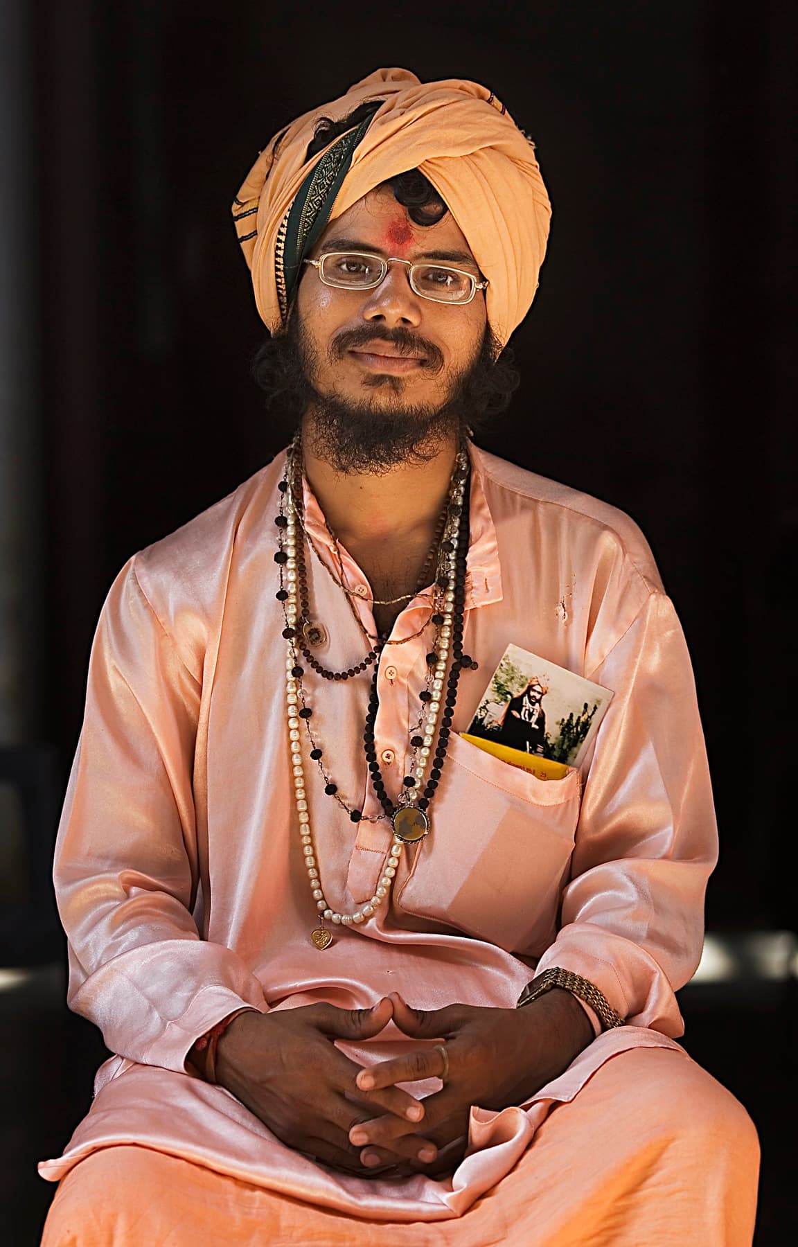 A Hindu priest seated for a portrait in Varanasi